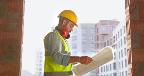 Male inspector analyzing the work of builders using virtual reality glasses. Man Stock Footage 172285933