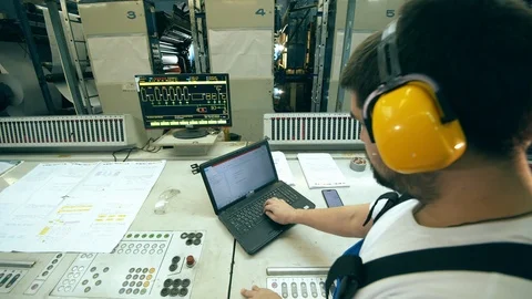 Male inspector is working with computerized equipment Stock Footage 127487371