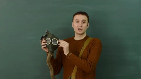 Male instructor shows how to use the gas mask. Stock Footage 68685230