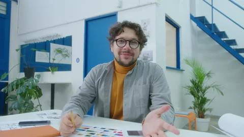Male Interior Designer Looking at Camera and Talking in the Office Stock Footage 248167826
