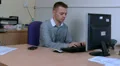 Male is interupted by work phone HD Footage