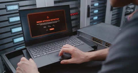 Male IT Engineer Handling DDoS Alert During Real Time Network Security Response Stock Footage 344968471