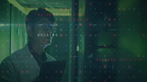 Male IT engineer holding tablet, alerts appearing and causing focused monitoring Stock Footage 332900463