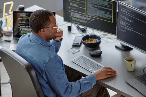 Male IT Engineer Reviewing Code Searching for Bugs Stock Photos