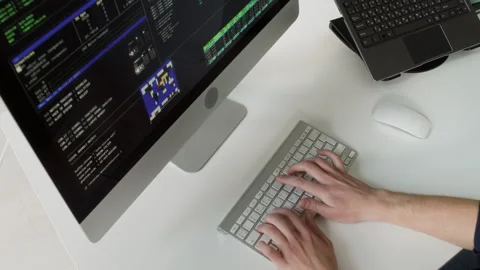 Male IT Specialist Typing on Computer Keyboard Editing Code at Office Desk Stock Footage 330127499