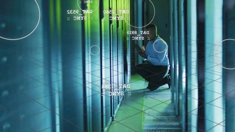 Male IT tech kneeling in data center aisle, tapping tablet, diagnosing rack Stock Footage 333287120
