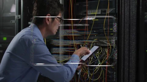 Male IT tech swiping tablet and tracing patch cables, stabilizing HUD overlay, Stock Footage 332566027