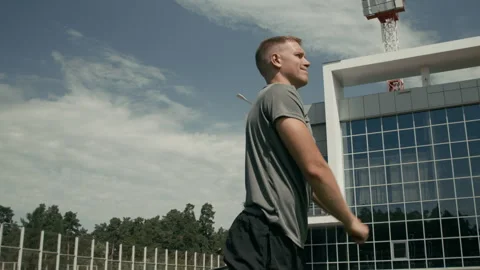 Male Javelin Thrower with Limb Difference Training Outdoors Video stock 297958288
