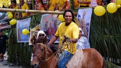 Male jockey on horseback joins in the annual Huego de Anillo contest Stock Photos