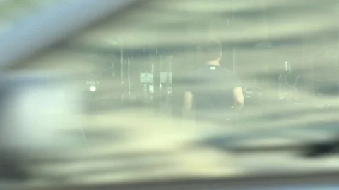 Male jogger crossing tramway while jogging Stock-Footage 84513136