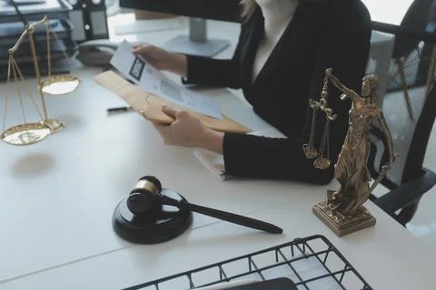 Male lawyer working with contract papers and wooden gavel on tabel in court.. Stock Photos