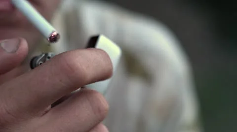 Male lighting cigarette Stockbeeldmateriaal 12616252