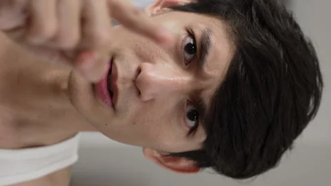 Male looking at camera as mirror Video stock 219398787