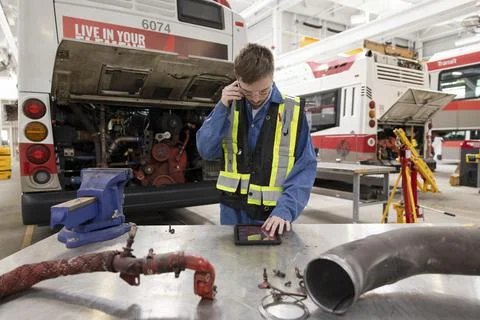 Male maintenance facility engineer using digital tablet Stock Photos