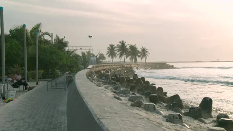 Male, Maldives sea wall pedestrian prome... | Stock Video | Pond5