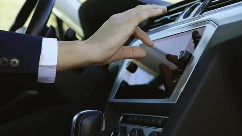 Male man hand touching, tapping, zoom out on screen monitor on modern luxury car Stock Footage 194752293