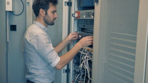 Male Man Server IT Engineer Work In Data Center. 库存影片 104178235