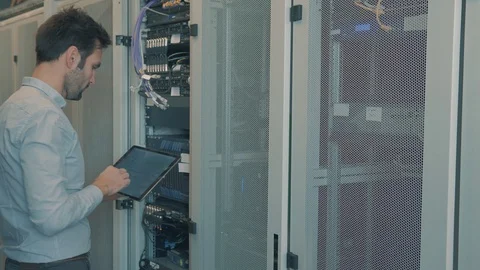 Male Man Server IT Engineer Work In Data Center. 库存影片 104179150