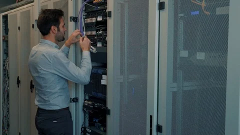 Male Man Server IT Engineer Work In Data Center. 库存影片 104179306
