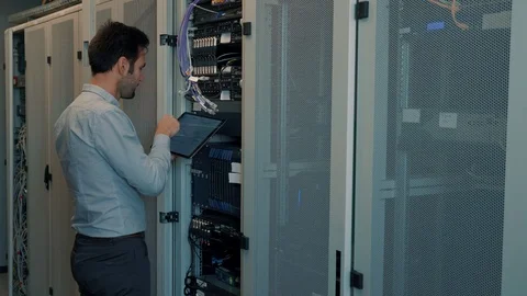 Male Man Server IT Engineer Work In Data Center. 库存影片 104179370