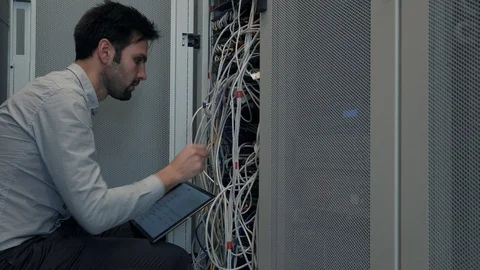 Male Man Server IT Engineer Work In Data Center. 库存影片 104179465