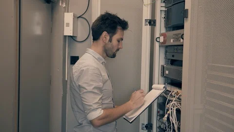 Male Man Server IT Engineer Work In Data Center. 库存影片 104179608