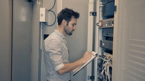 Male Man Server IT Engineer Work In Data Center. 库存影片 104199159