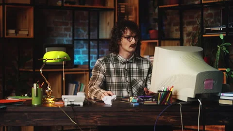 Male manager from 90s working on computer in vintage office, typing on keyboard Stock Footage 321072030