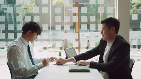 Male manager is talking or explaining about having to dismiss the employee wh Stock Footage 155330659