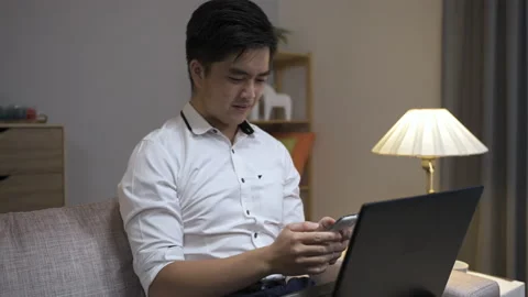 Male manager is texting message on mobile Video stock 159008595