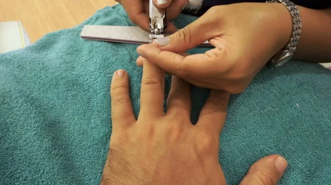 Male manicaure at asian beauty salon Stock Footage