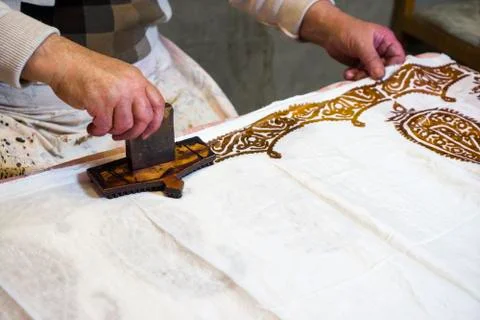 Male master puts patterns on Oriental, Turkish silk women's shawls, Texture,  Stock Photos