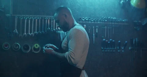 Male master taking wire from wall with organized tools Video stock 259392803