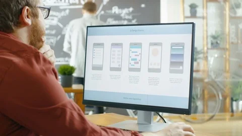 Male Mobile Game Application Developer Works on a Personal Computer. Stock Footage 82862713