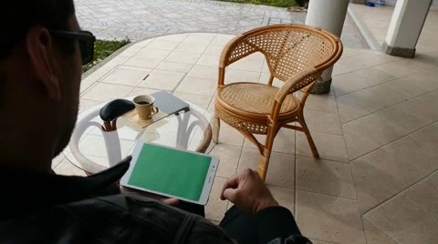 Male Model In Dark Jacket Looking At Ipad - Tablet Technology Internet Search Stock Footage 49044374