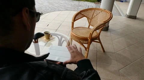 Male Model In Dark Jacket Looking At Ipad - Tablet Technology Internet Search Stock Footage 49045339