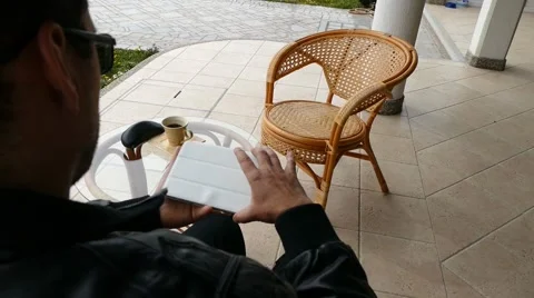 Male Model In Dark Jacket Looking At Ipad - Tablet Technology Internet Search Stock Footage 49045917