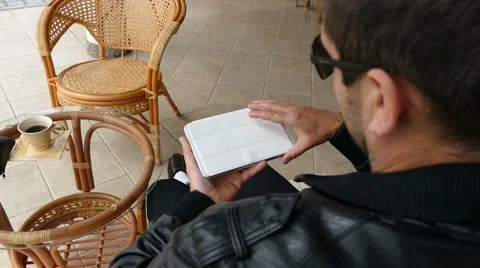 Male Model In Dark Jacket Looking At Ipad - Tablet Technology Internet Search Stock Footage 49064264