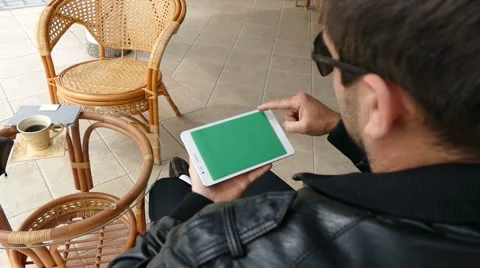 Male Model In Dark Jacket Looking At Ipad - Tablet Technology Internet Search Stock Footage 49065191