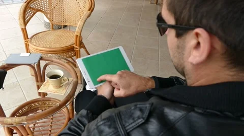 Male Model In Dark Jacket Looking At Ipad - Tablet Technology Internet Search Stock Footage 49066365