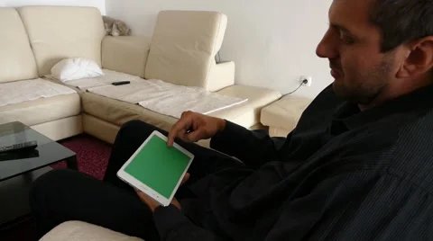 Male Model In Dark Jacket Looking At Ipad - Tablet Technology Internet Search Stock Footage 49147841