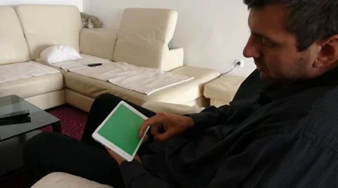 Male Model In Dark Jacket Looking At Ipad - Tablet Technology Internet Search Stock Footage 49148974