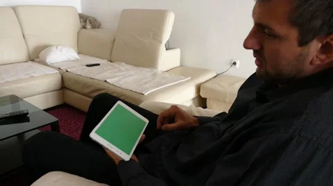 Male Model In Dark Jacket Looking At Ipad - Tablet Technology Internet Search Stock Footage 49149189