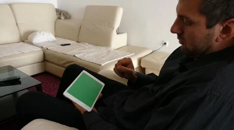 Male Model In Dark Jacket Looking At Ipad - Tablet Technology Internet Search Stock Footage 49149319