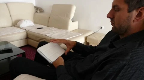 Male Model In Dark Jacket Looking At Ipad - Tablet Technology Internet Search Stock Footage 49184600