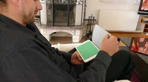 Male Model In Dark Jacket Looking At Ipad - Tablet Technology Internet Search Stock Footage 49185985