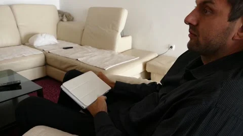 Male Model In Dark Jacket Looking At Ipad - Tablet Technology Internet Search Stock Footage 49188593