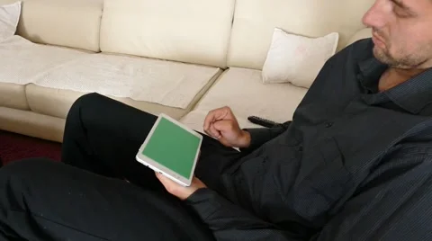 Male Model In Dark Jacket Looking At Ipad - Tablet Technology Internet Search Stock Footage 49216492