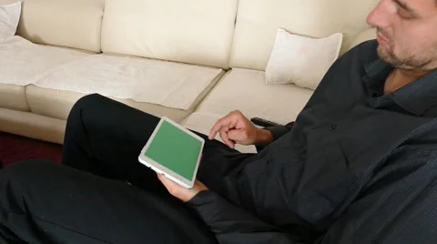 Male Model In Dark Jacket Looking At Ipad - Tablet Technology Internet Search Stock Footage 49217305