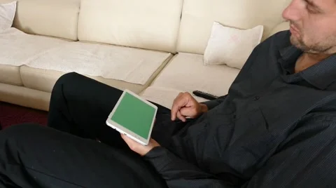 Male Model In Dark Jacket Looking At Ipad - Tablet Technology Internet Search Stock Footage 49217336